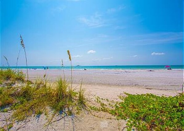On the beach, sun loungers, beach towels