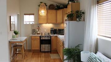 1 bedroom, desk, iron/ironing board, travel crib