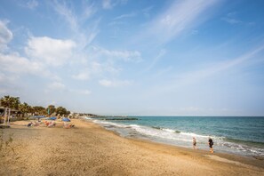 On the beach, sun loungers, beach umbrellas, beach towels