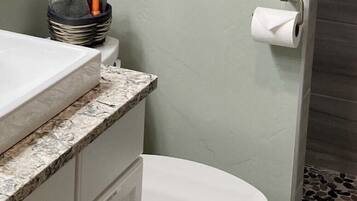 Shower, hair dryer, towels, soap