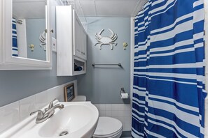 Bathtub, hair dryer, towels, soap
