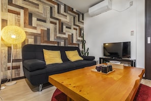 City Townhome | Living area | 55-inch flat-screen TV with digital channels, TV