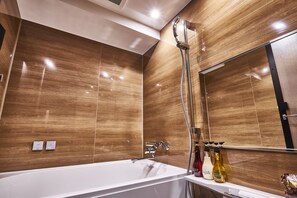 Combined shower/bathtub, hair dryer, bathrobes, slippers