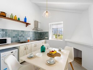 Fridge, microwave, cookware/dishes/utensils