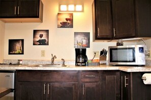 Fridge, microwave, stovetop, coffee/tea maker