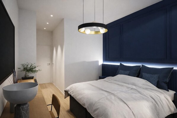 A modern bedroom with a large bed, a bedside table, a floor lamp, and a potted plant. - Admiral Hotel (Sorrento)