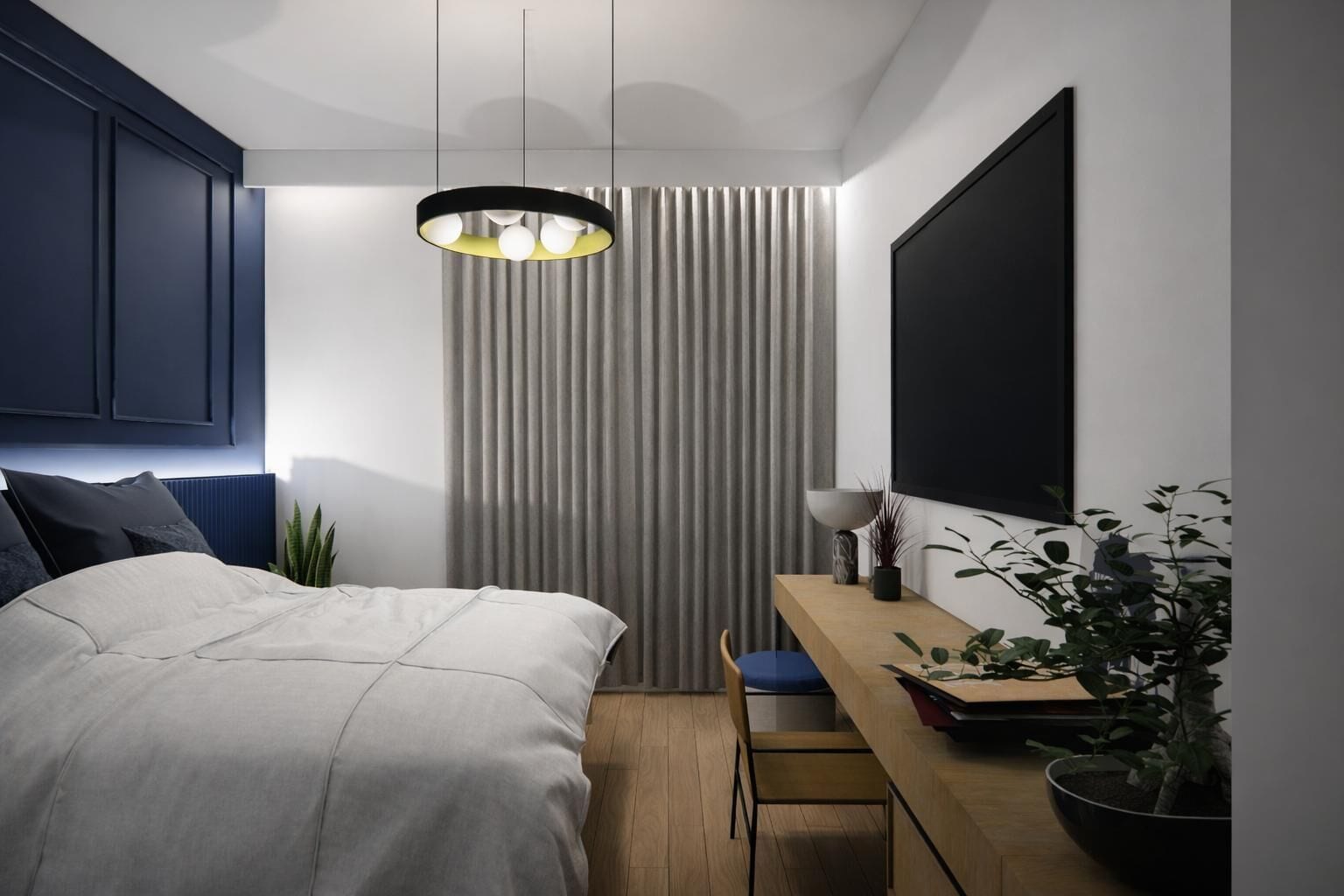 A modern bedroom with a bed, bedside table, and a hanging light fixture.