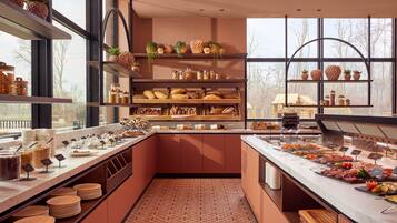 A buffet area with various food items and a view of trees outside.