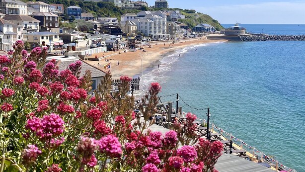 A coastal town with a beach, buildings, and a pier. - No 5 Old Church (Ventnor)