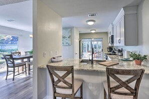 Enjoy meals in the spacious kitchen with a large island and dining area.