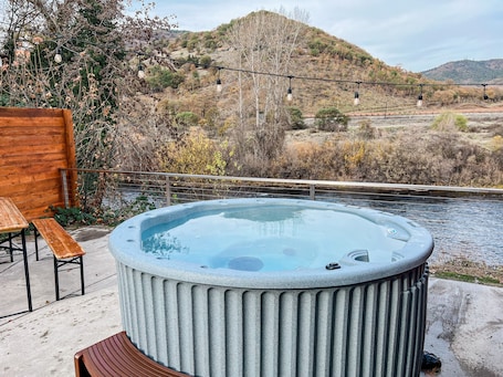 Property grounds. Charming 2 BR riverside stopover in Gold Hill. Private hot tub, river access, and just down the road from Del Rio Vineyards. Perfect base for exploring the Rogue Valley. Pet-friendly!
