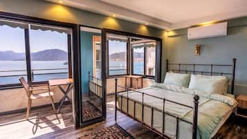 Deluxe Room | Premium bedding, minibar, in-room safe, individually decorated