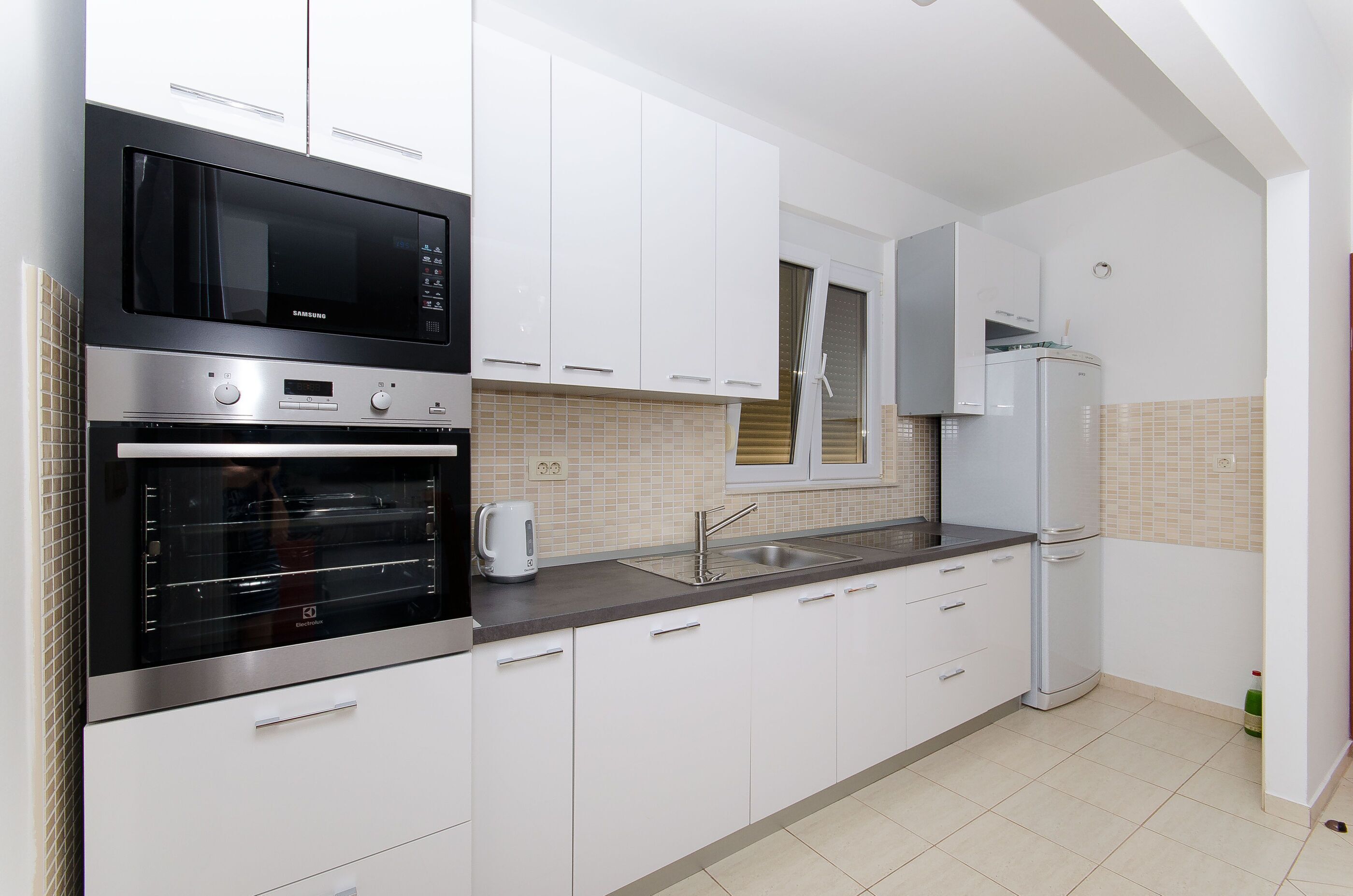 Villa | Private kitchen | Fridge, microwave, oven, stovetop