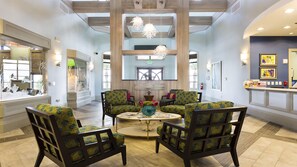 Relax in the spacious lobby with comfortable seating and a warm atmosphere.