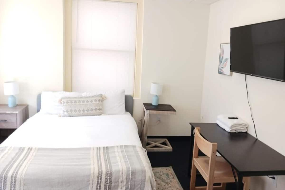 Memory foam beds, desk, laptop workspace, WiFi (free)