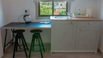 Fridge, microwave, electric kettle, cookware/dishes/utensils