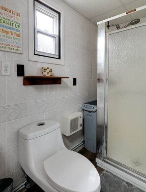 Shower, hair dryer, towels, toilet paper