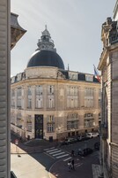 A historic building with a prominent dome and classical architecture.