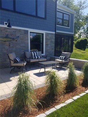 Relax in a serene outdoor space with a patio set and comfortable seating.