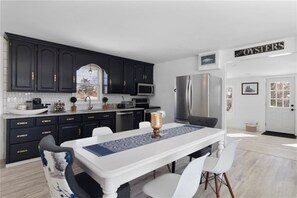 Enjoy meals at the dining table, which offers a convenient space for eating and socializing.