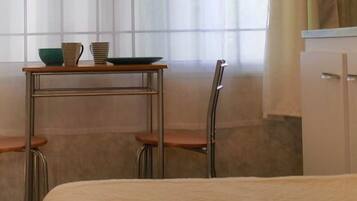 1 bedroom, desk, iron/ironing board, travel crib