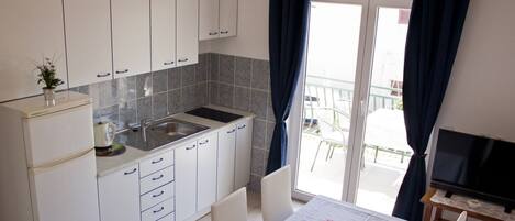 Microwave, stovetop, coffee/tea maker, toaster