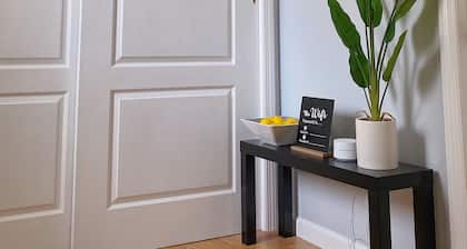 Cozy king suite with kitchen and dining area.