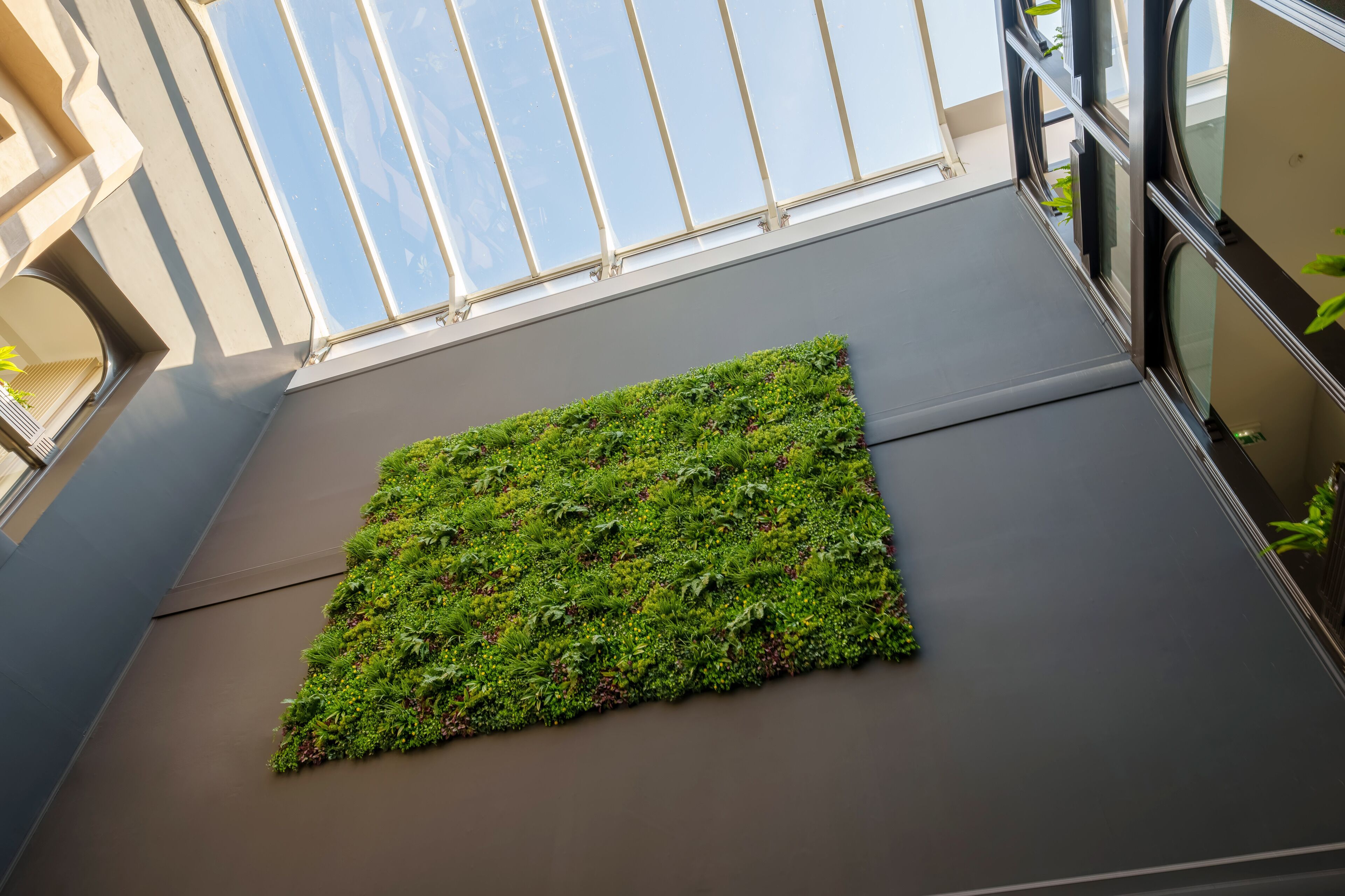 A modern building with a rooftop garden.