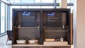 A breakfast bar with 'hot' and 'not' signs indicating available and unavailable food items.