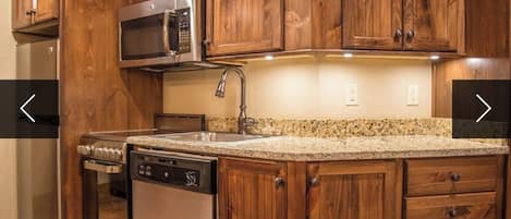 Microwave, dishwasher, coffee/tea maker, cookware/dishes/utensils