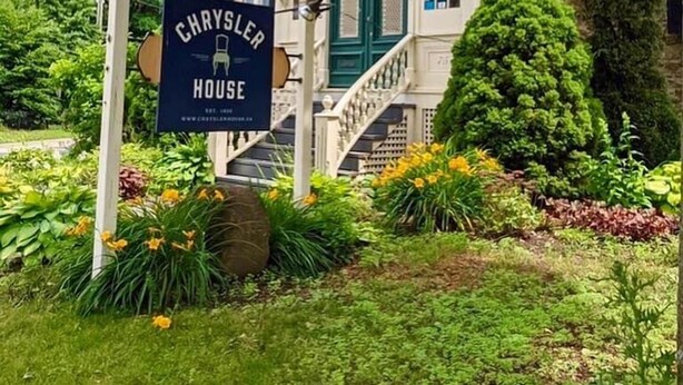A historic building with a sign reading "Chrysler House."