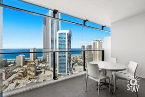Outdoor dining - Circle on Cavill – 1 Bedroom + Study Ocean — QStay (Surfers Paradise)