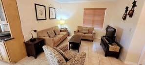 Condo, Multiple Beds, Pool Access, Pool View | Living area | TV