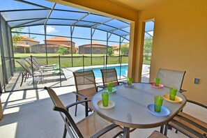Outdoor dining - Pool Home in Gated Golf Community With Game Room & Themed Kid's Rooms (Davenport)