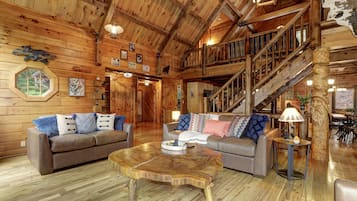 Smart TV, fireplace, books, computer monitors