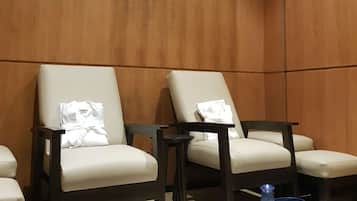 Relax in a serene space with a seating area and self-service amenities.
