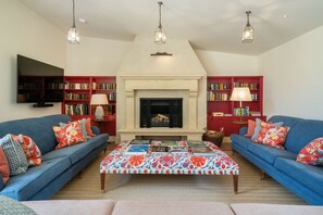 TV, fireplace, table football, books