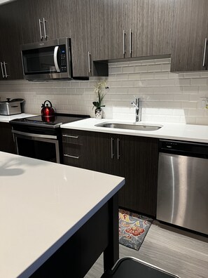 Microwave, dishwasher, cookware/dishes/utensils