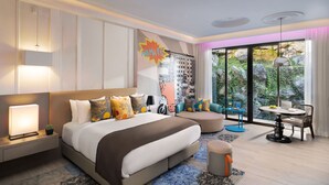 A modern hotel room with a large bed, a desk, and a view of greenery through the windows. - Norbu The Montanna, Dharamshala - IHCL SeleQtions (Dharamshala)
