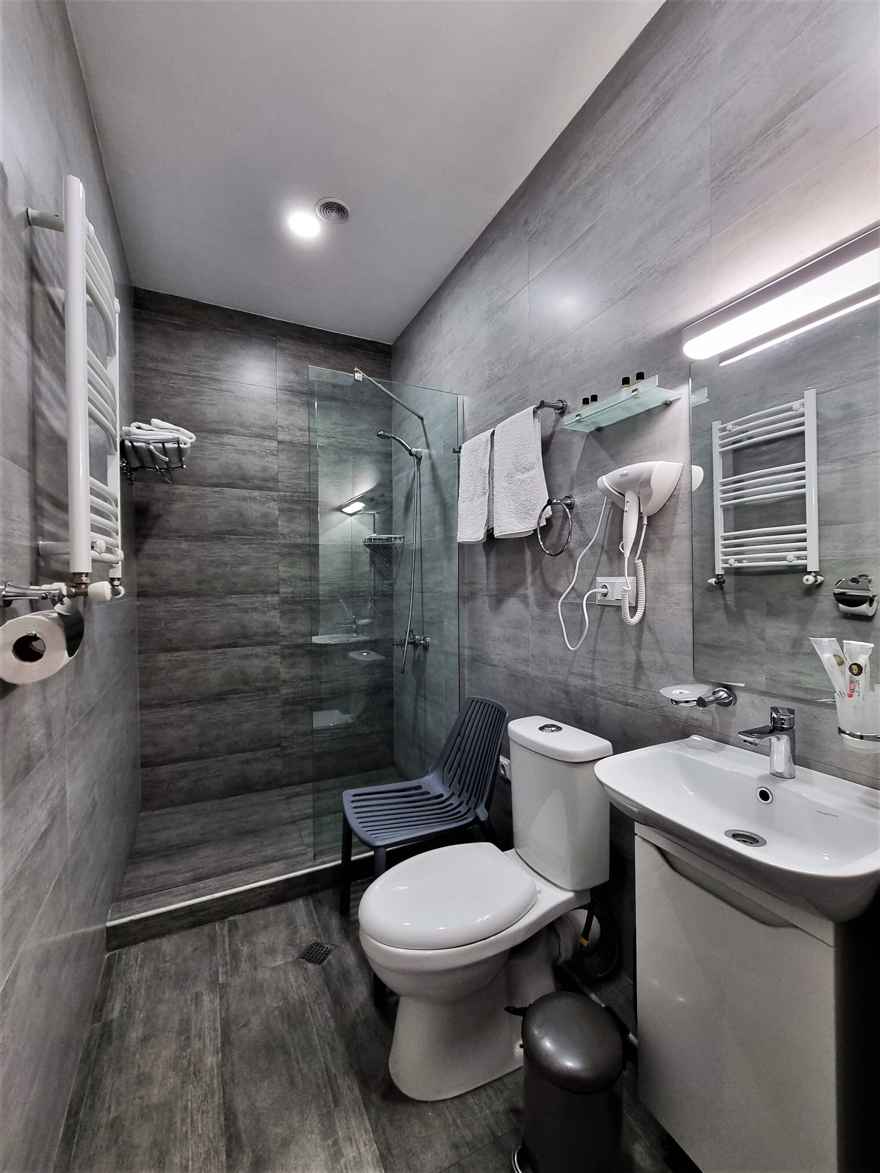 junior double room | bathroom | shower, rainfall showerhead, designer toiletries, hair dryer