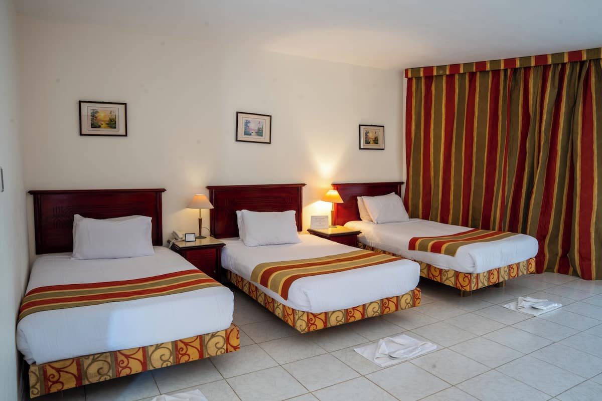 Superior Triple Garden View | Premium bedding, in-room safe, blackout drapes, WiFi