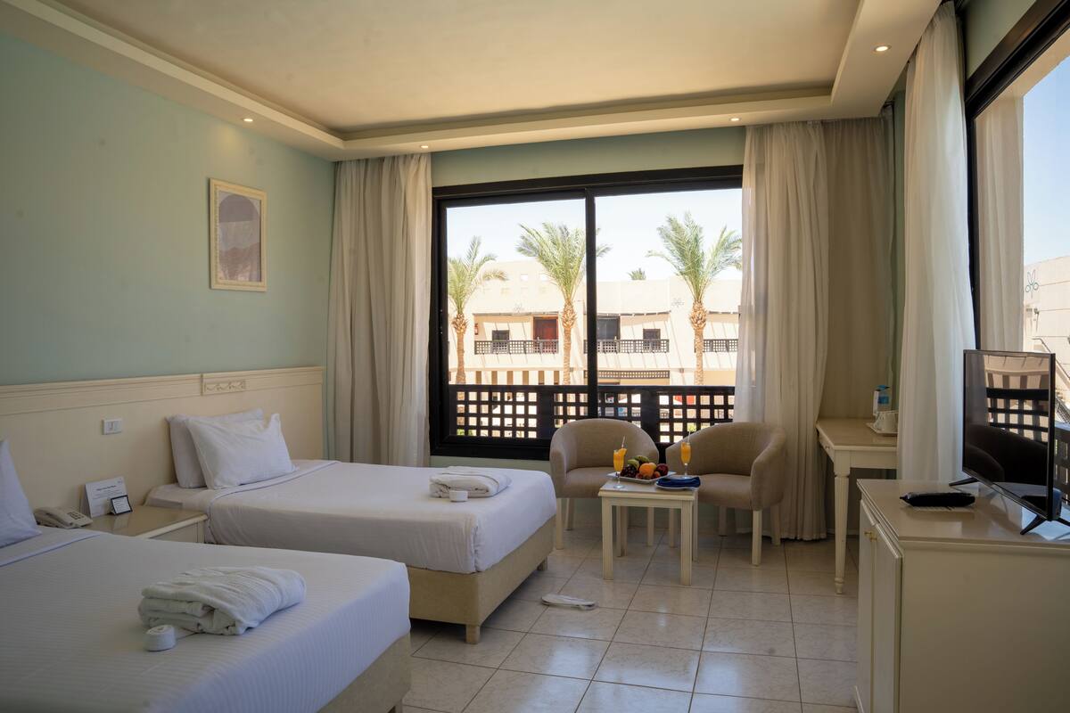 Superior King Garden View | Premium bedding, in-room safe, blackout drapes, WiFi