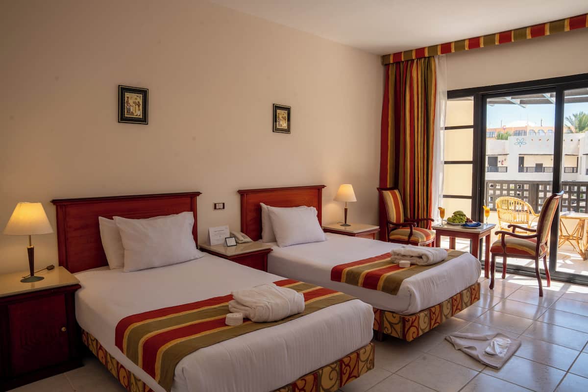 Superior Twin Pool View | Premium bedding, in-room safe, blackout drapes, WiFi