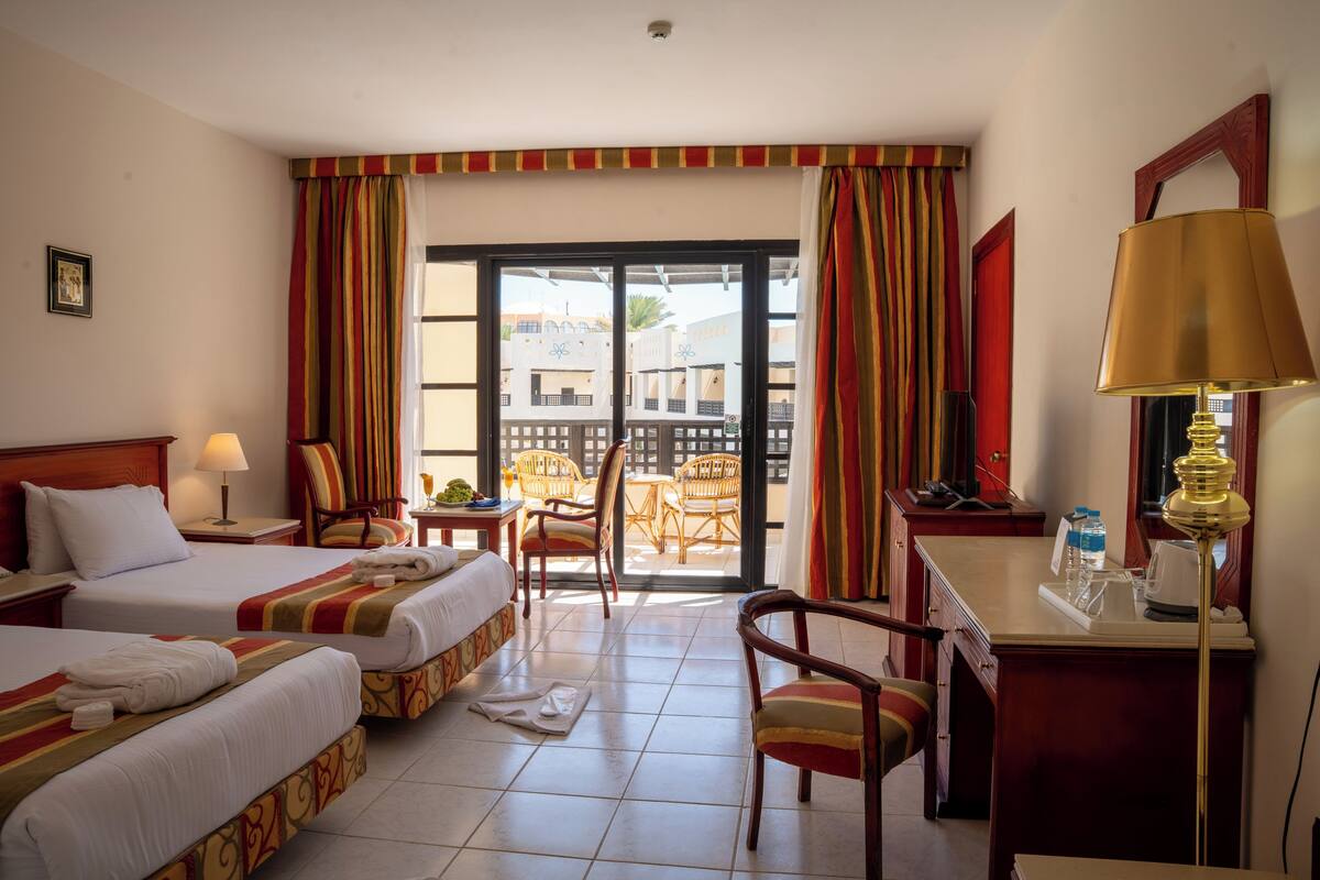 Deluxe Twin Pool View | Premium bedding, in-room safe, blackout drapes, WiFi
