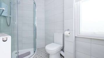 Bathtub, hair dryer, towels