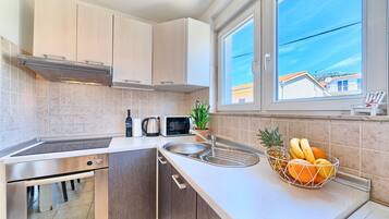 Fridge, microwave, toaster, cookware/dishes/utensils