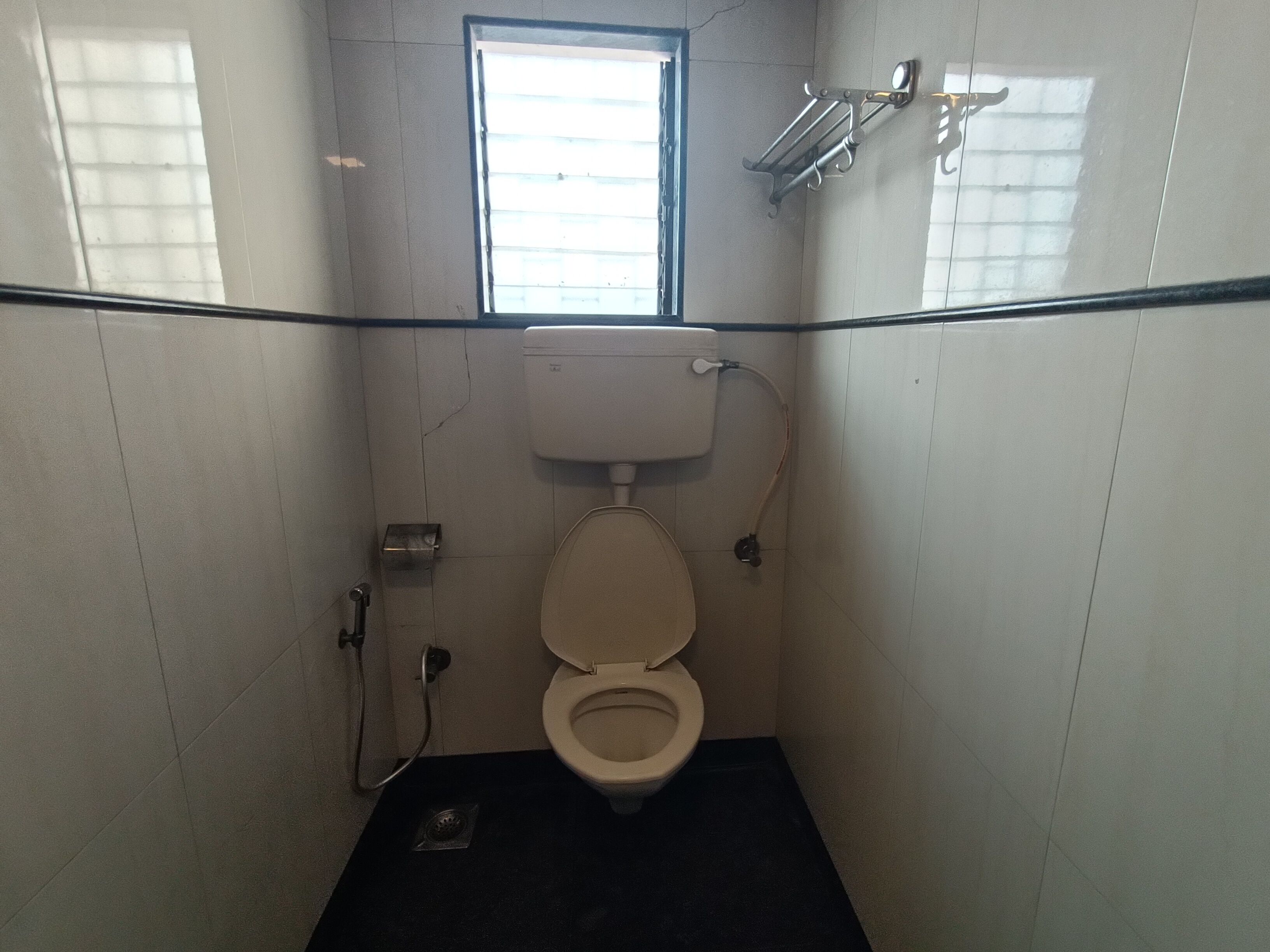 deluxe room | bathroom | shower, rainfall showerhead, towels, soap