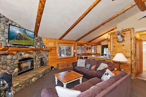 TV, fireplace - Bear Butte Lodge by Destination Big Bear: Gorgeous Gilligan Log Home in Moonridge! Hot Tub! Pool Table! (Big Bear City CA)