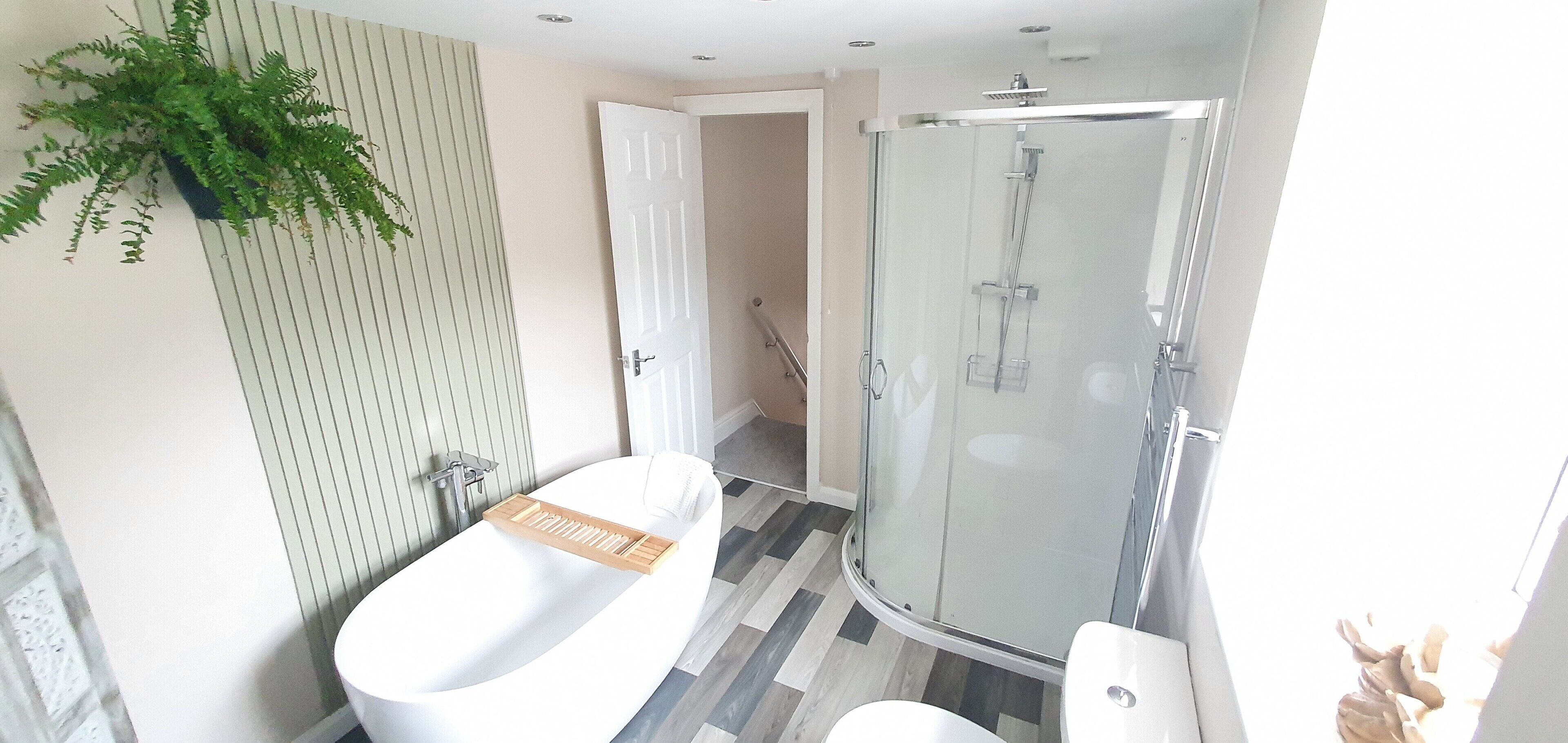 House, Multiple Beds | Bathroom | Separate bathtub and shower, deep-soaking bathtub, hair dryer, towels