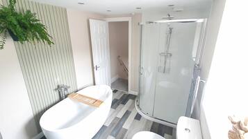 House, Multiple Beds | Bathroom | Separate bathtub and shower, deep-soaking bathtub, hair dryer, towels